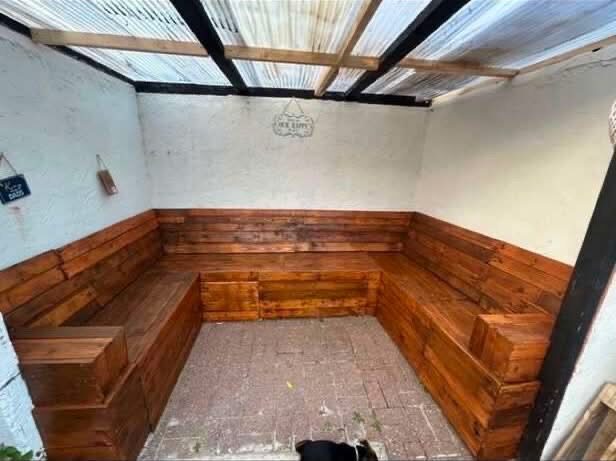 After: finished corner bench seating, stained a rich warm brown