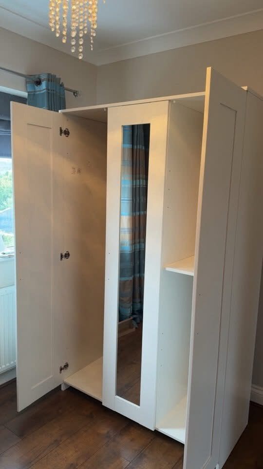 Finished mirrored wardrobe fitted in a bedroom